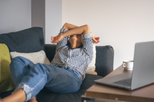 frustrated woman on couch at work